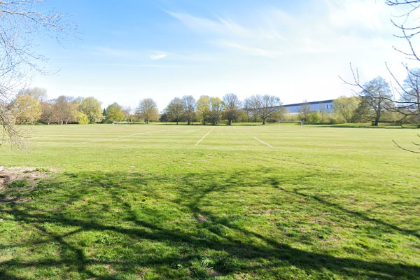 Open green fields and blue skies over Alvaston Park