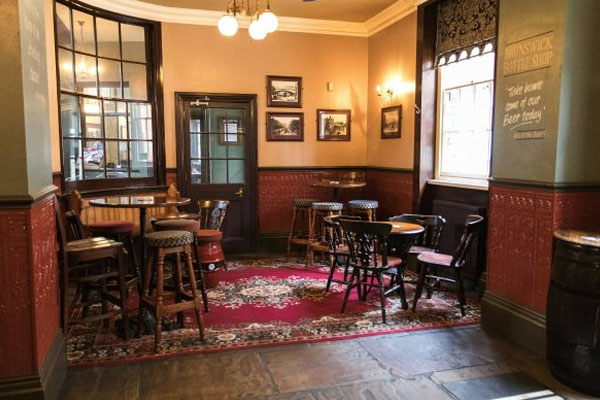 Traditional seating area inside The Brunswick Inn, Derby’s iconic real ale pub
